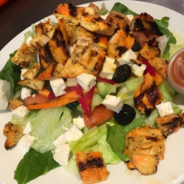 Al Hamra Kabob Grill's Mediterranean salad with grilled chicken, feta, olives, and vegetables.